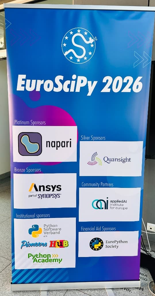 EuroSciPy 2026 sponsor banner at the venue in Kraków